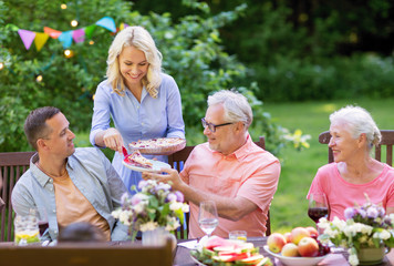 happy family having dinner or summer garden party