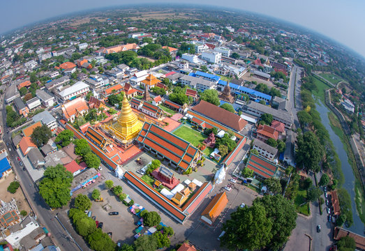 Aerial view of Wat Phra That Hariphunchai pagoda temple important religious traveling destination in Lamphun province northern of Thailand. icture high resolution from DSLR camera shot on helicopter