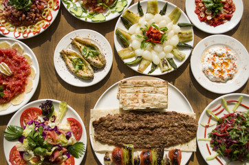 Kebab; healthy and fresh salad varieties and appetizer on wooden table
