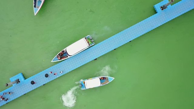 4K Top view of speedboat approaching to pier