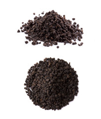 black granulated tea on the white background