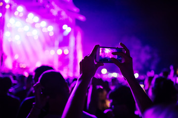 Fototapeta na wymiar People Taking Photos At A Music Concert