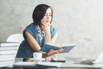 Focused female secretary at office desk
