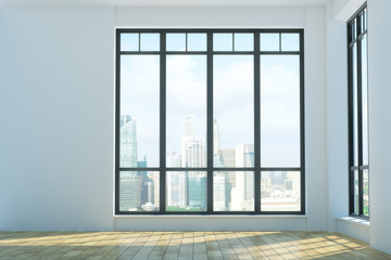 Obraz premium Jasne nieumeblowane wnętrze z widokiem na miasto