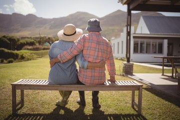 Senior couple sitting together on bench