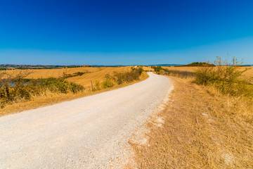 road running through Senese Clays landscape