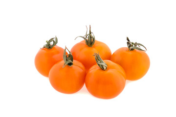 small orange tomatoes on a white background