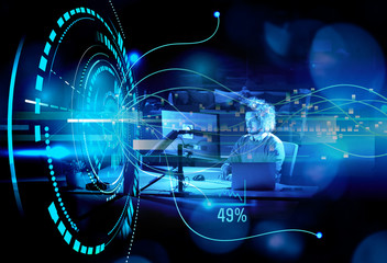 man working on computer in dark office