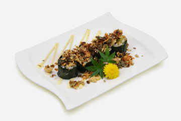 Dry fish roll on white plate and white background