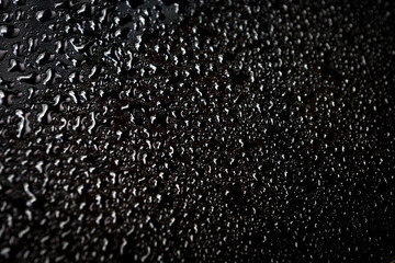 water drops on a black background after a rain