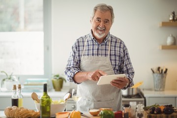 Senior man using digital tablet
