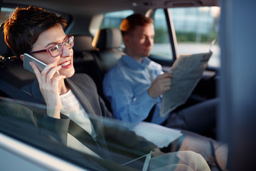 young business woman use smartphone in the car.