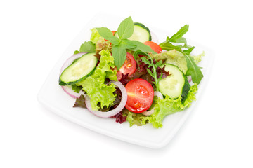Fresh vegetable salad isolated on white
