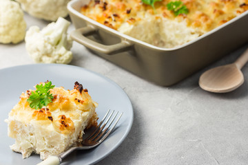 Cauliflower casserole on concrete background.