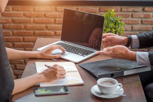 Business people discuss project in office