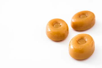 Toffee caramel candy isolated on white background. Copyspace.

