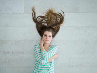 Fototapeta premium beautiful girl lying on floor