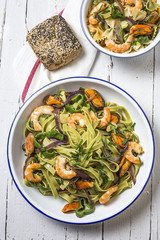 Green tagliatelle with seafood. Mussels; Prawns