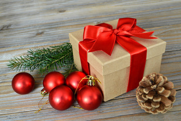Christmas gift with red ribbon and Christmas decoration