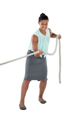 Businesswoman pulling the rope