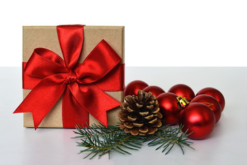 Fototapeta na wymiar Christmas gift, pine cone and Christmas balls