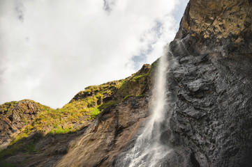 Obraz premium Caucasian waterfall high in the mountains
