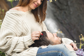 A loving couple of hipsters on walks