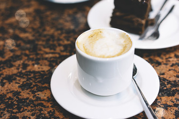 Close up drinking cup of hot aroma coffee isolated on the table in breakfast time, morning sun day, holiday relax concept