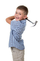 Funny kid boy in blue checkered shirt swunging with a hammer and smiling against white background