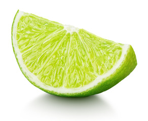 Ripe slice of green lime citrus fruit isolated on white background