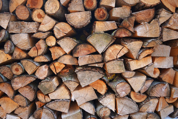 Close up of wooden background of fire woods. Autumn season texture.