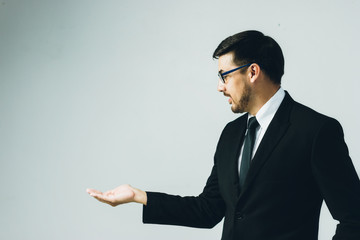 Obraz na płótnie Canvas Business man with empty hand on white background.