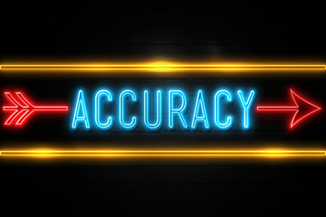 Obraz premium Accuracy - fluorescent Neon Sign on brickwall Front view