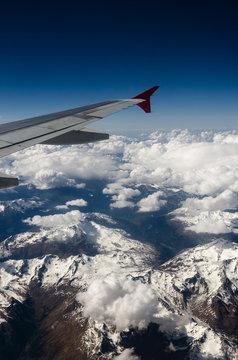 Fototapeta Austrian Alps mountains seen from an airplane window
