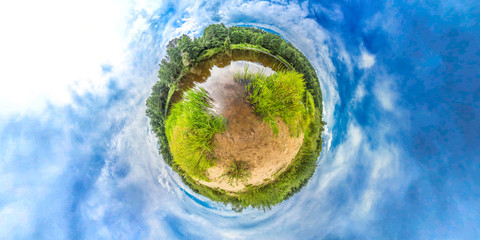 Little planet with river, forest and blue sky. Planet Earth.