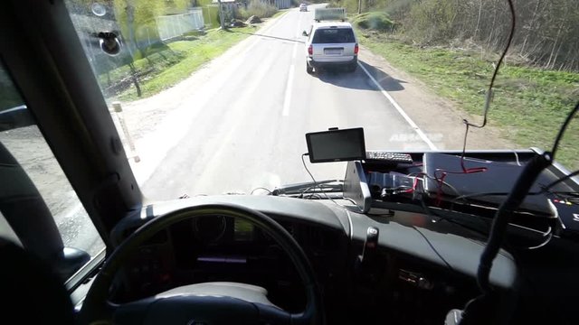 Inside of Cabin View of the Professional Truck Driver