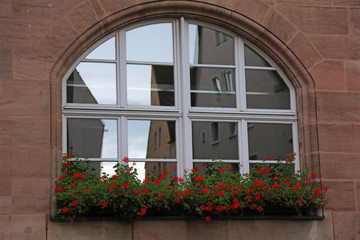 Balcony with windows and flowers
