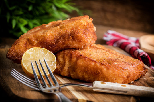 Two fried cod fillet pieces.