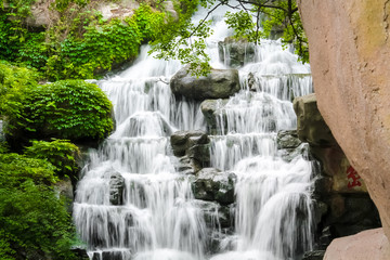 Fototapeta na wymiar Waterfall in Chinese park