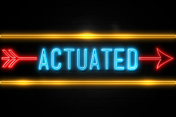 Actuated  - fluorescent Neon Sign on brickwall Front view