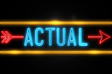 Fototapeta premium Actual - fluorescent Neon Sign on brickwall Front view