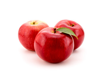 Ripe red apples on a white