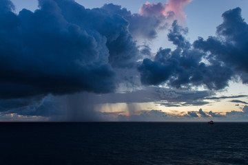 Showers and clouds at sea