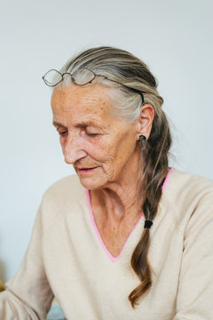 Indoor Portrait of Senior Woman with Grey Hair