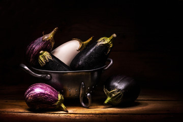 eggplants inside vintage colander