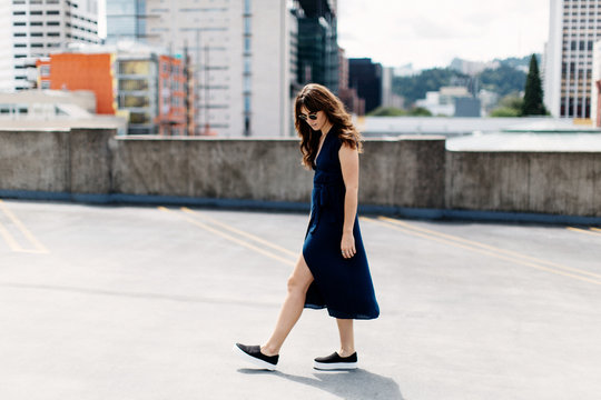 Girl in blue dress on rooftop