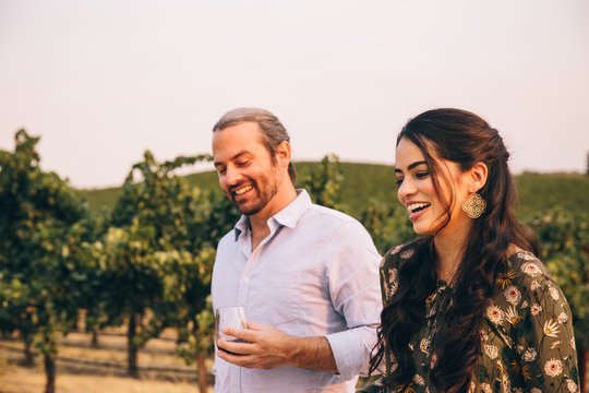 Man and Woman in a Vineyard at Sunset