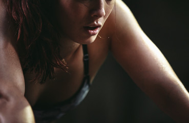 Active, fit mixed race woman training hard on box jumps in worko