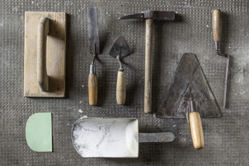 Masonry tools on stone background