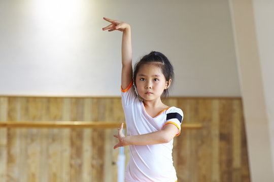 cute little aisan girl practice dance indoor